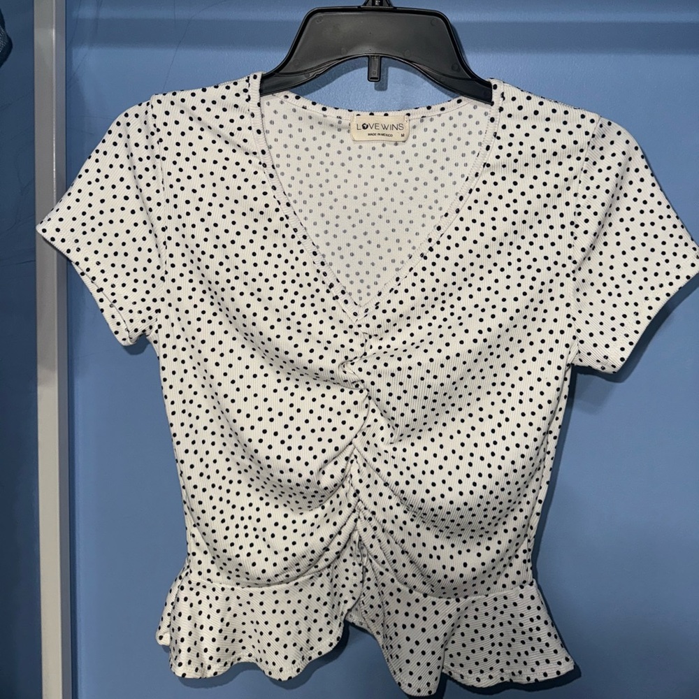 Polka dot peplum style blouse